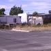 Samora Machel Primary: Parking lot and shacks
